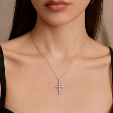 Close-up of Crowned in Grace crown of thorns cross necklace worn on a woman
