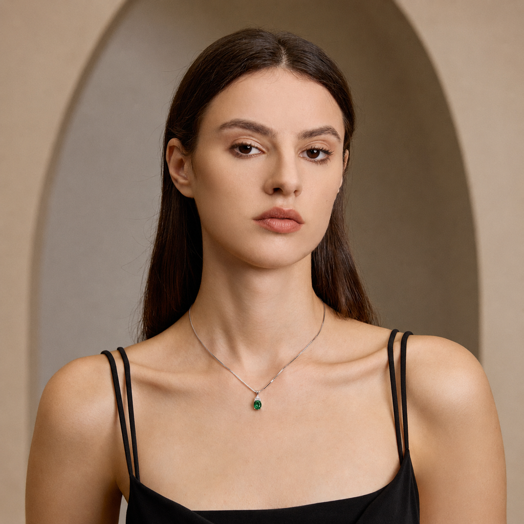 Model wearing Starlit Garden emerald necklace with moissanite accents