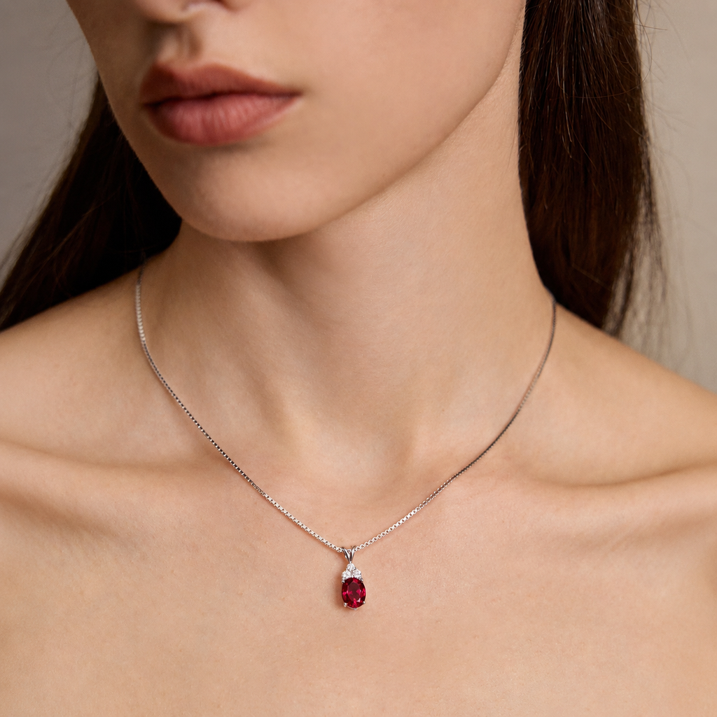 Close-up of model wearing Starlit Garden ruby necklace with moissanite accents