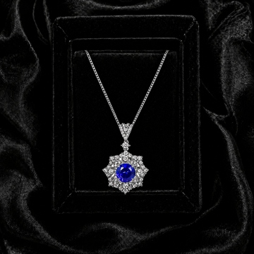 Ariadne’s Celestial Crown royal blue sapphire necklace displayed in a black velvet jewelry box