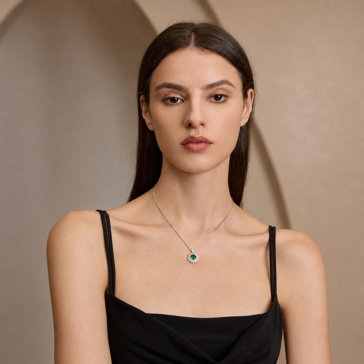 Model wearing the Moon Halo Emerald Necklace with a vivid green lab-grown emerald and moissanite double halo pendant
