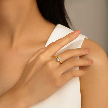 Model wearing Eve’s Embrace D-color moissanite solitaire ring in heavy 18K gold plated 925 sterling silver