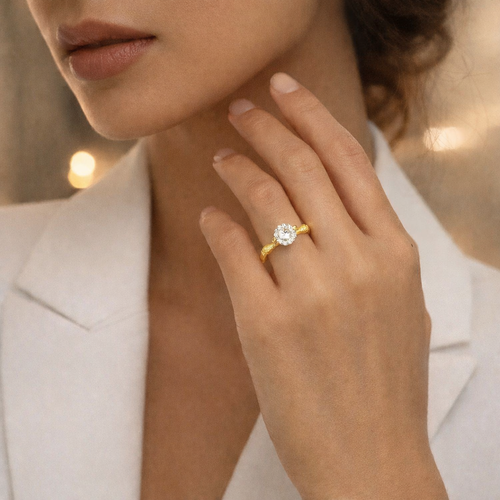 Model wearing Eve’s Embrace D-color moissanite solitaire ring in heavy 18K gold plated 925 sterling silver