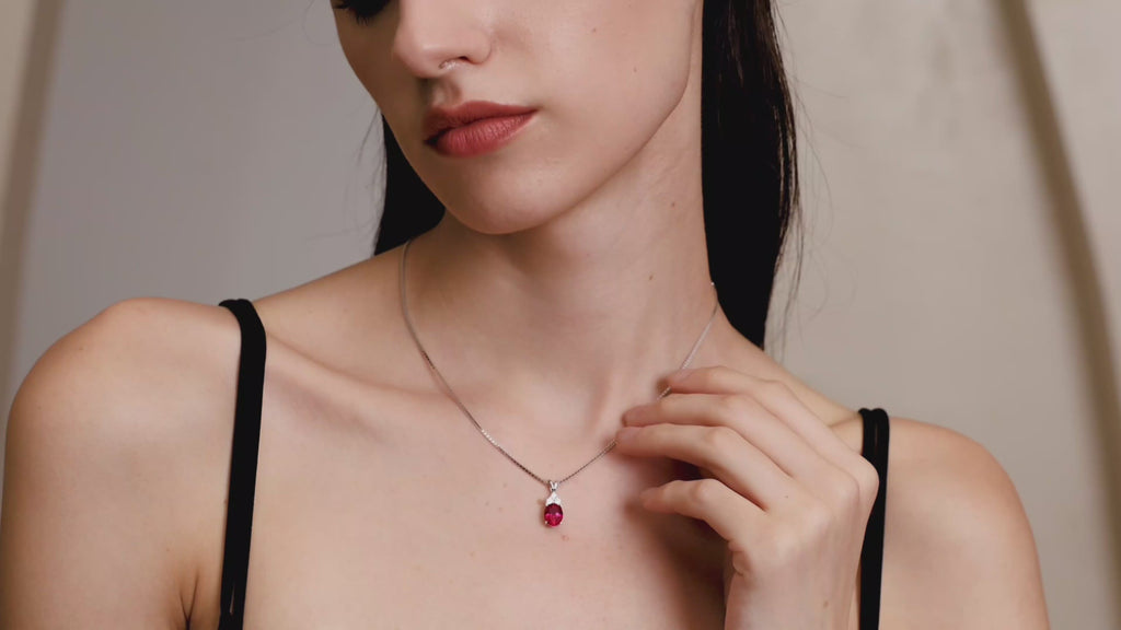 Model wearing the Starlit Garden Ruby Necklace featuring a lab-grown pigeon blood ruby pendant in 925 sterling silver