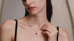 Model wearing the Starlit Garden Ruby Necklace featuring a lab-grown pigeon blood ruby pendant in 925 sterling silver