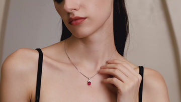 Model wearing the Starlit Garden Ruby Necklace featuring a lab-grown pigeon blood ruby pendant in 925 sterling silver