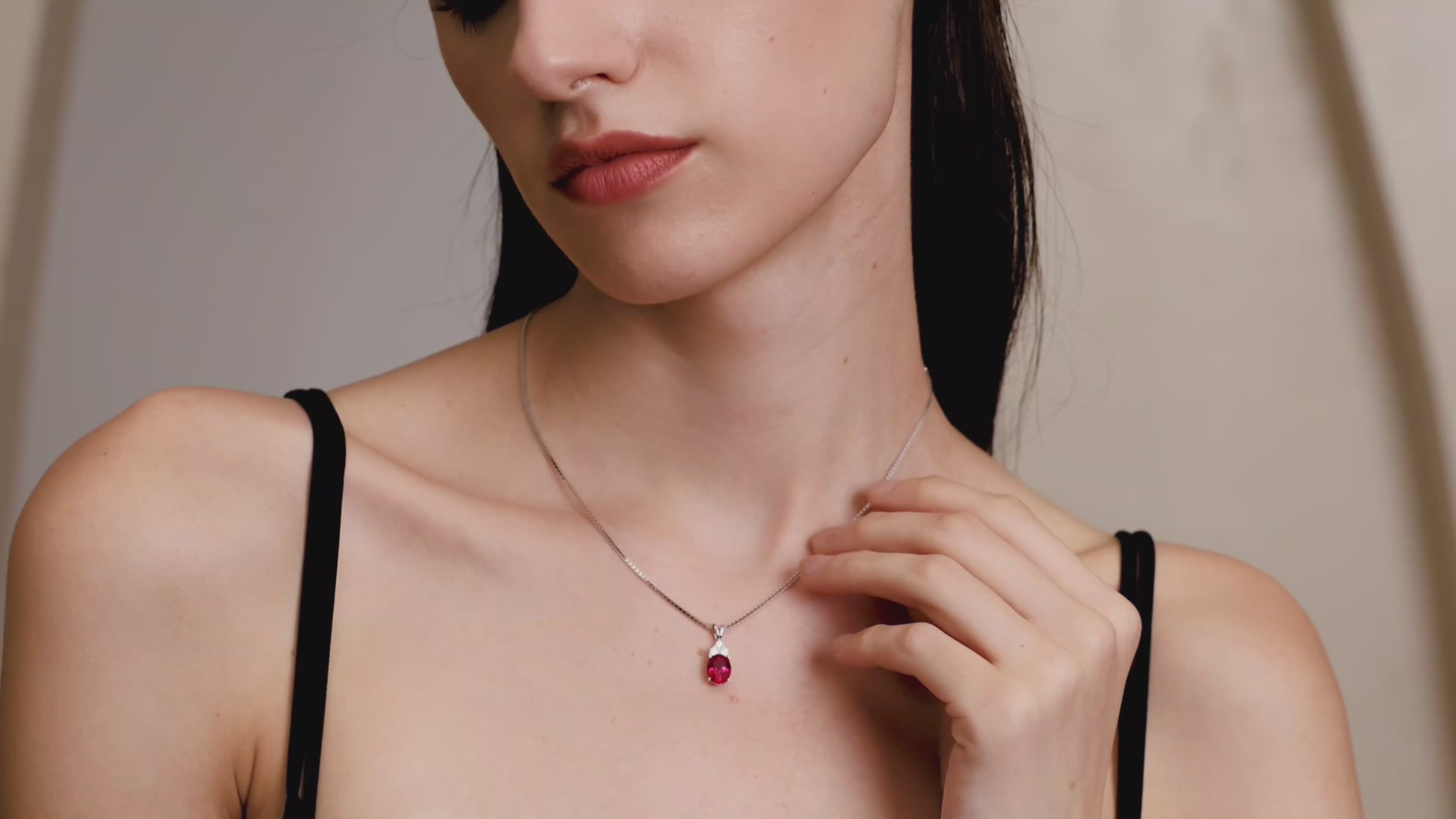 Model wearing the Starlit Garden Ruby Necklace featuring a lab-grown pigeon blood ruby pendant in 925 sterling silver