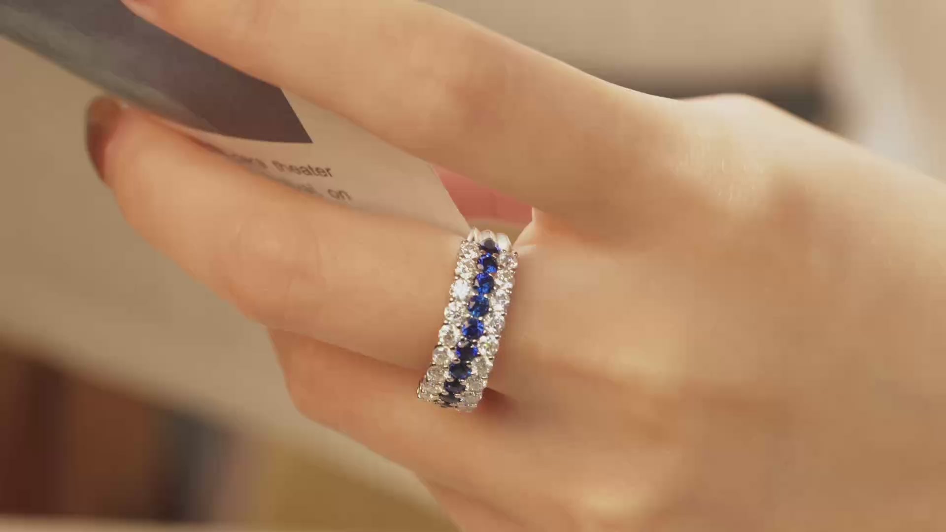 Video of three-row lab-grown blue sapphire and moissanite ring worn on hand in rhodium-plated 925 sterling silver