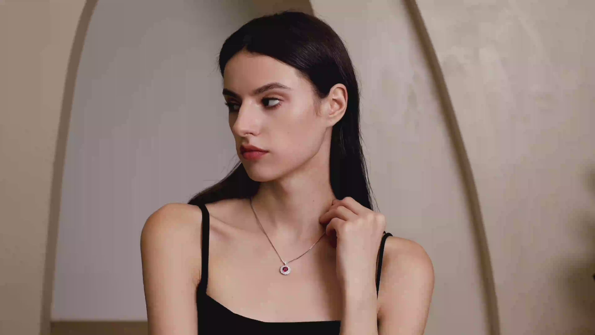 Model wearing the Moon Halo Ruby Necklace, showing the pendant sparkle, necklace length, and everyday styling