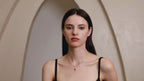 Model wearing Starlit Garden vivid pink sapphire necklace with moissanite accents