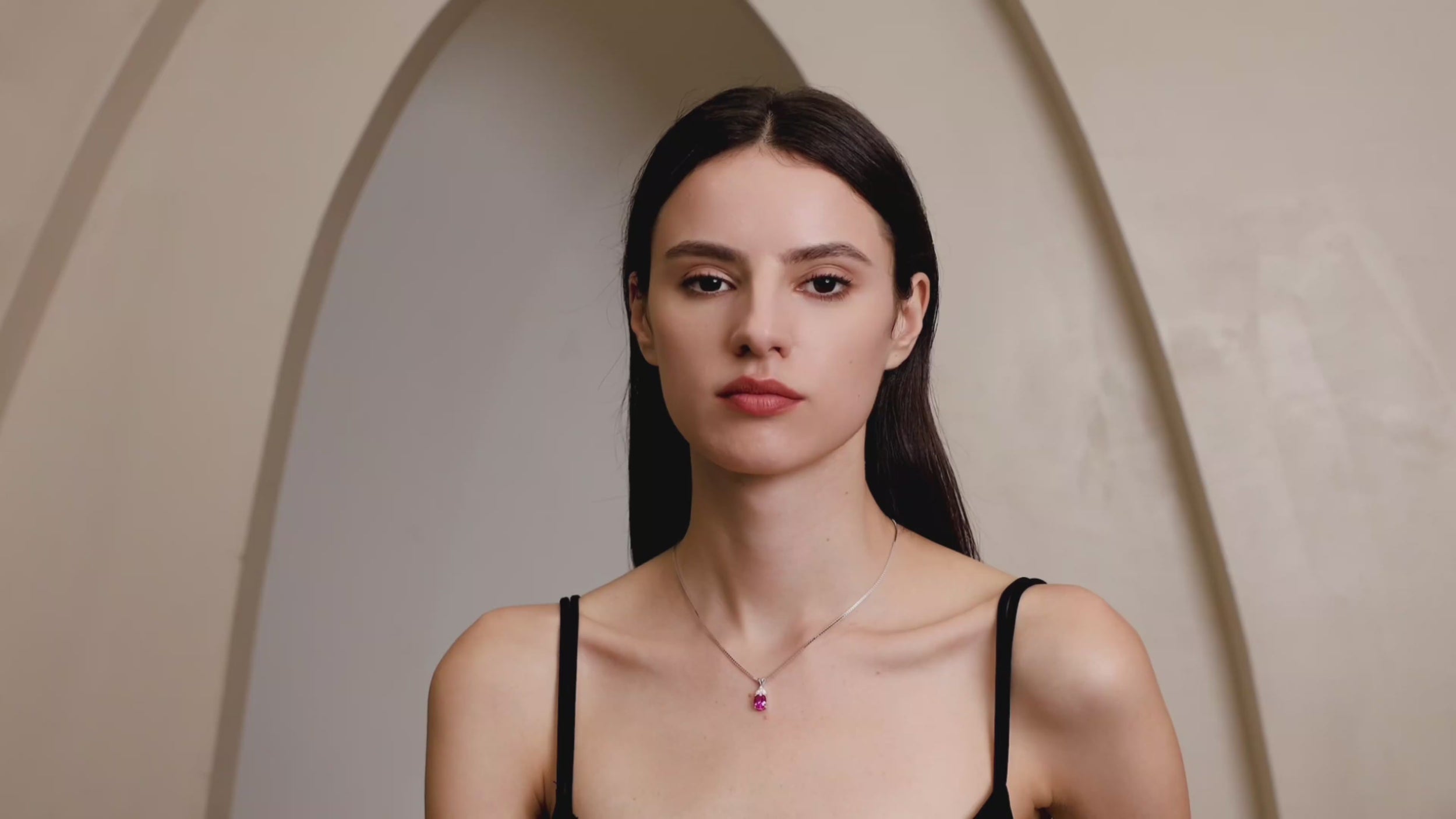 Model wearing Starlit Garden vivid pink sapphire necklace with moissanite accents