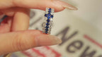 Video of cross-inspired lab-grown blue sapphire and moissanite ring worn on hand in rhodium-plated 925 sterling silver