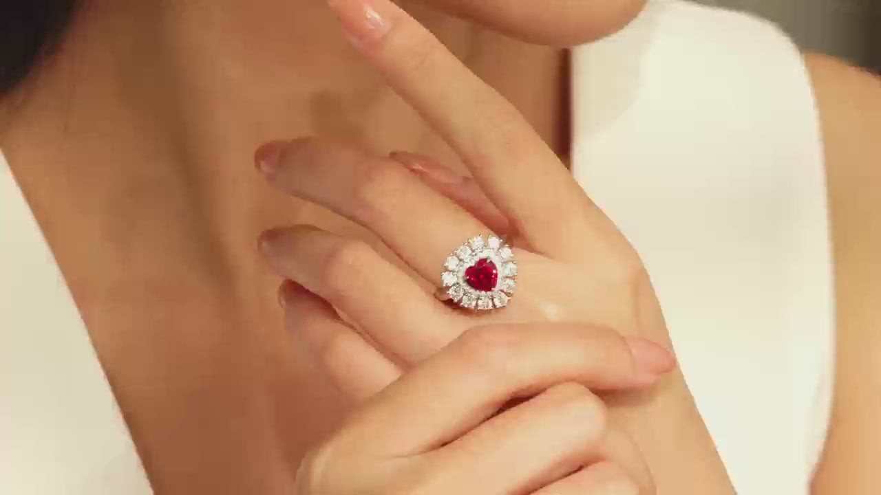 Video of model wearing a heart-shaped lab-grown ruby ring with double moissanite halo in 925 sterling silver