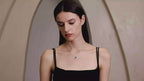 Model wearing the Moon Halo Blue Sapphire Necklace, showing the necklace length, pendant sparkle, and everyday styling