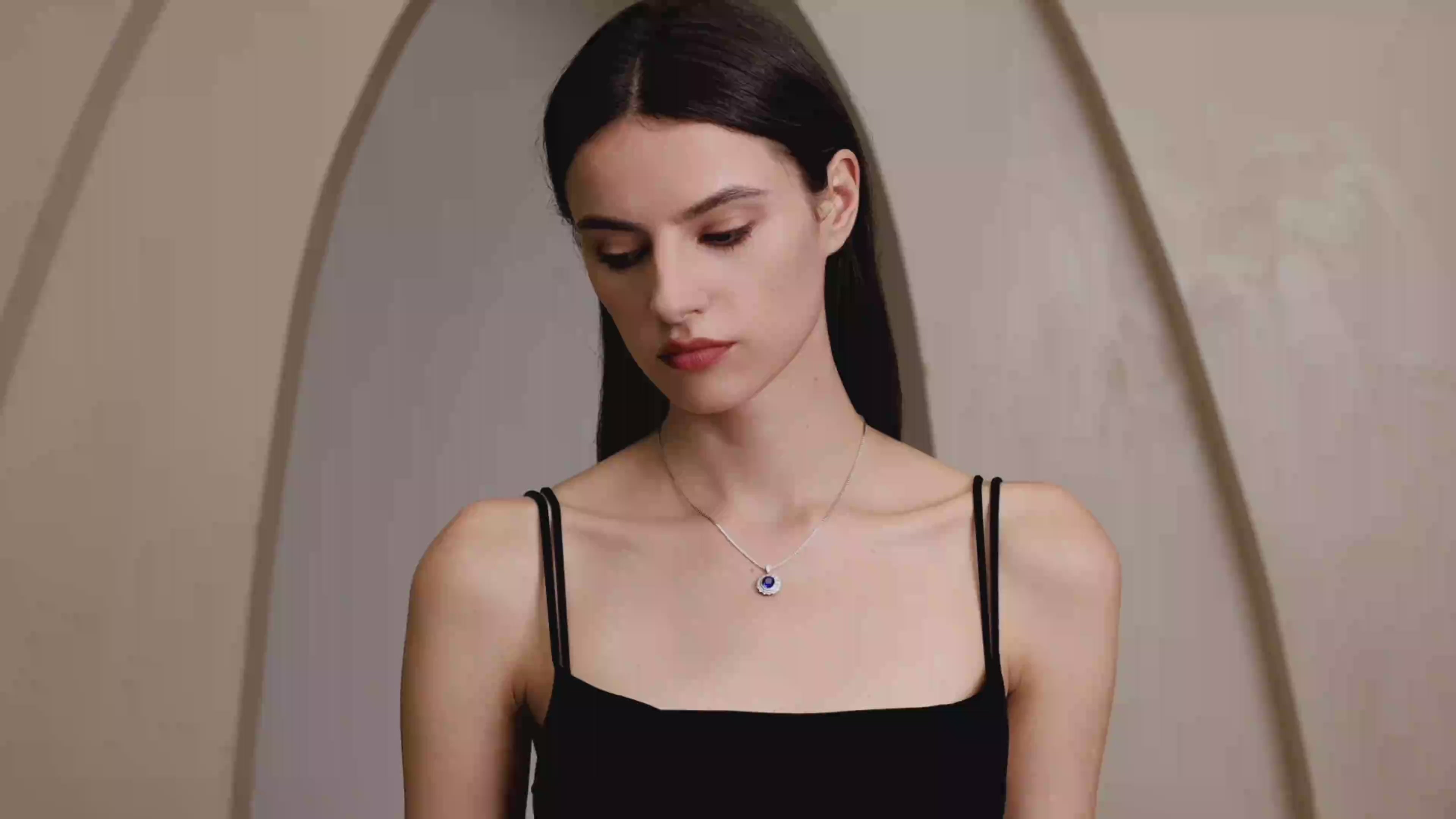 Model wearing the Moon Halo Blue Sapphire Necklace, showing the necklace length, pendant sparkle, and everyday styling