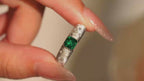 Video close-up of Starburst lab-grown emerald promise ring with D-color moissanite accents in rhodium-plated 925 sterling silver