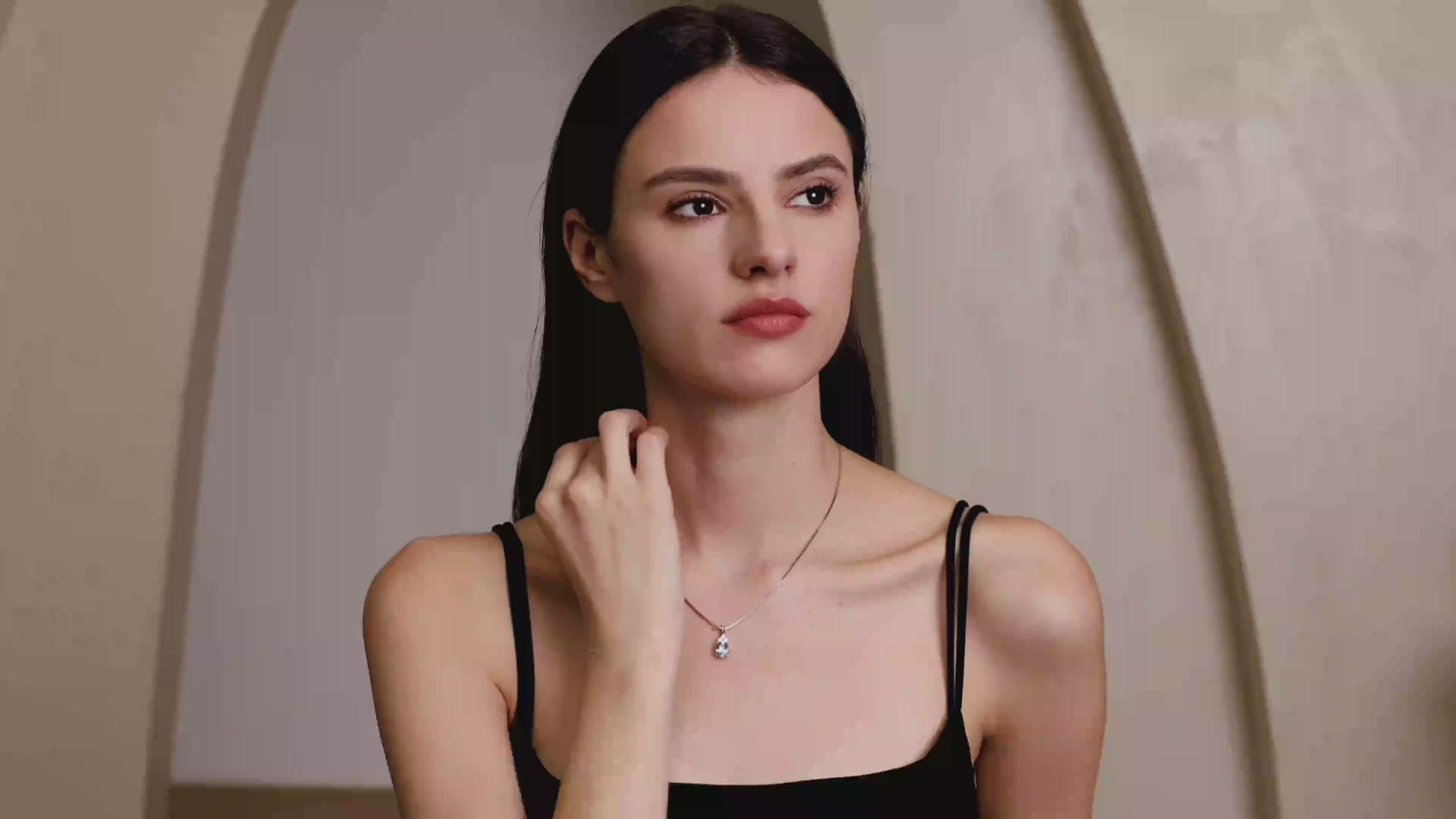 Model wearing Dellyrica aquamarine blue spinel necklace with moissanite accents in S925 sterling silver