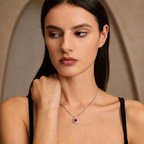 Model styling the Moon Halo Ruby Necklace with a delicate silver chain and ruby halo pendant