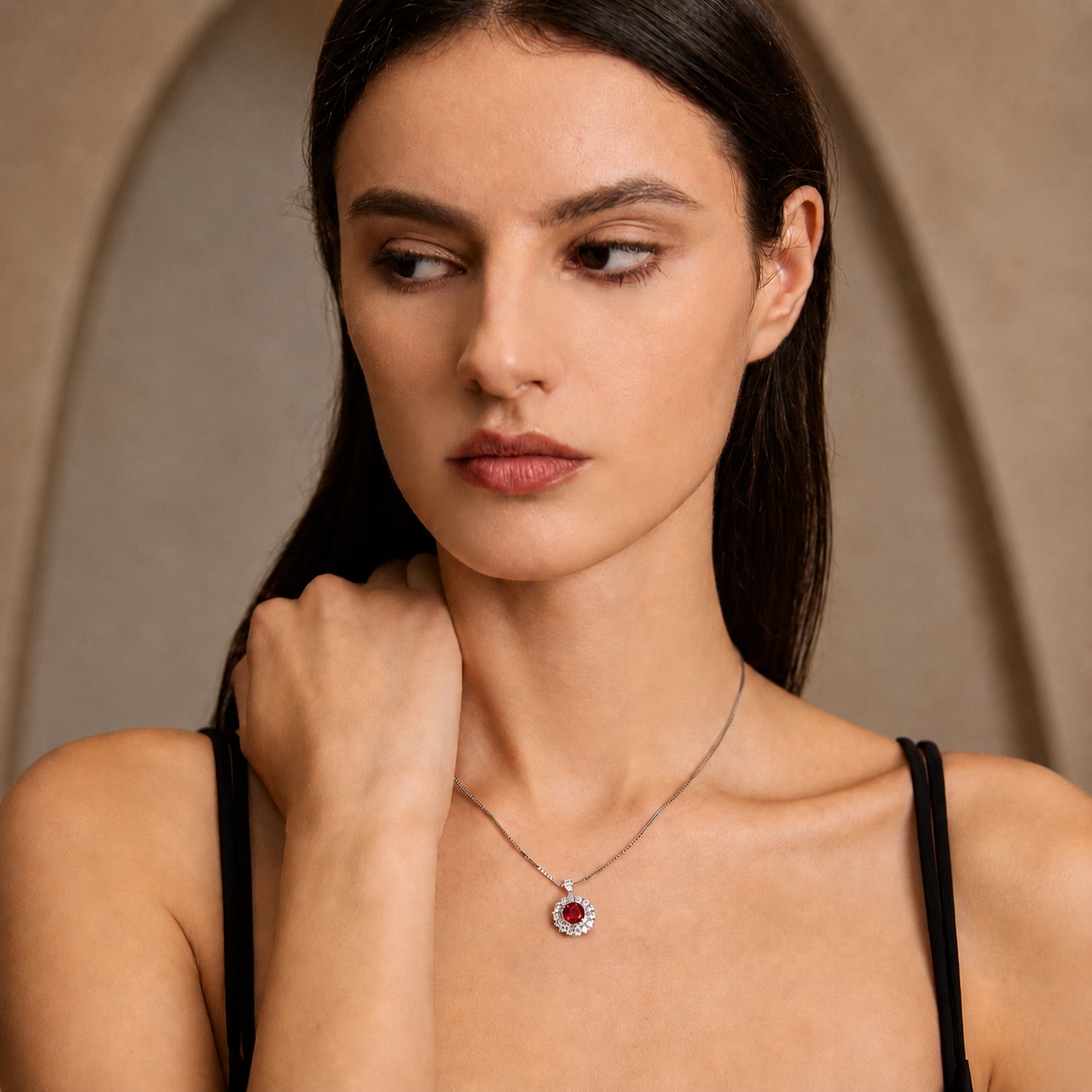 Model styling the Moon Halo Ruby Necklace with a delicate silver chain and ruby halo pendant