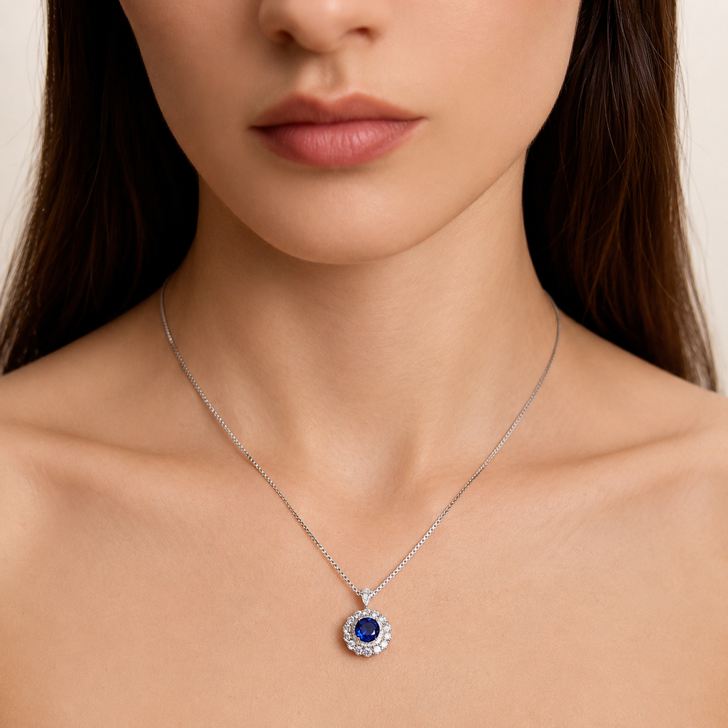 Model wearing the Moon Halo Blue Sapphire Necklace with a royal blue lab-grown sapphire pendant