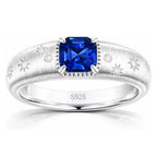 Starburst lab-grown blue sapphire ring with D-color moissanite accents in rhodium-plated 925 sterling silver