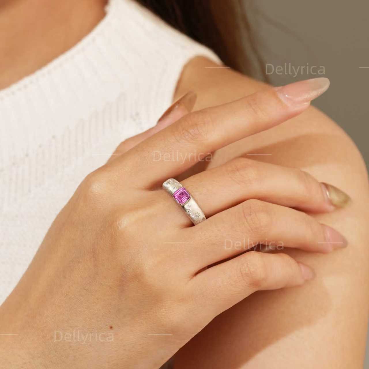 Starburst lab-grown pink sapphire promise ring worn on hand in rhodium-plated 925 sterling silver