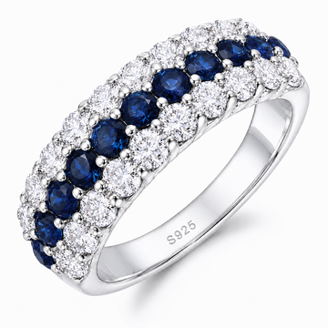Blue Sapphire & Moissanite Curved Band Ring with royal blue lab-grown sapphires, D-color moissanite accents, and rhodium-plated sterling silver band.